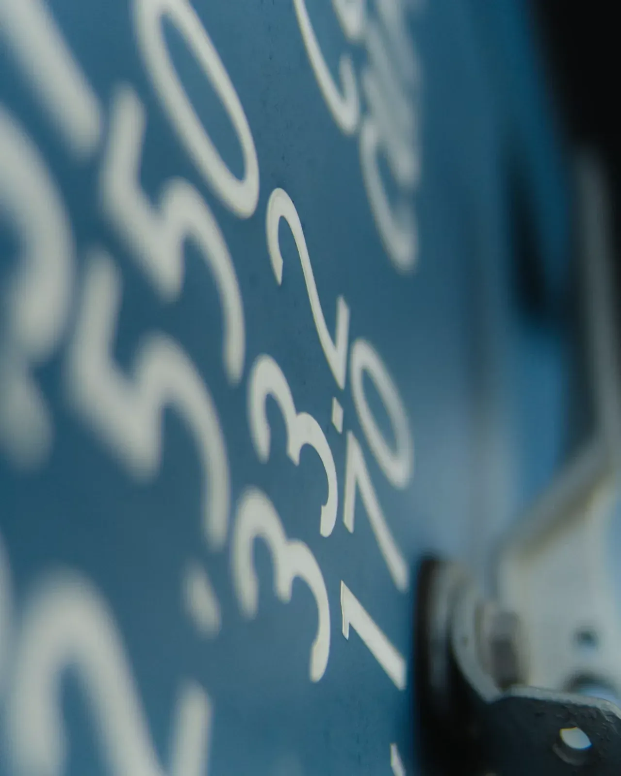 Close-up of large printed financial figures on a dark blue surface